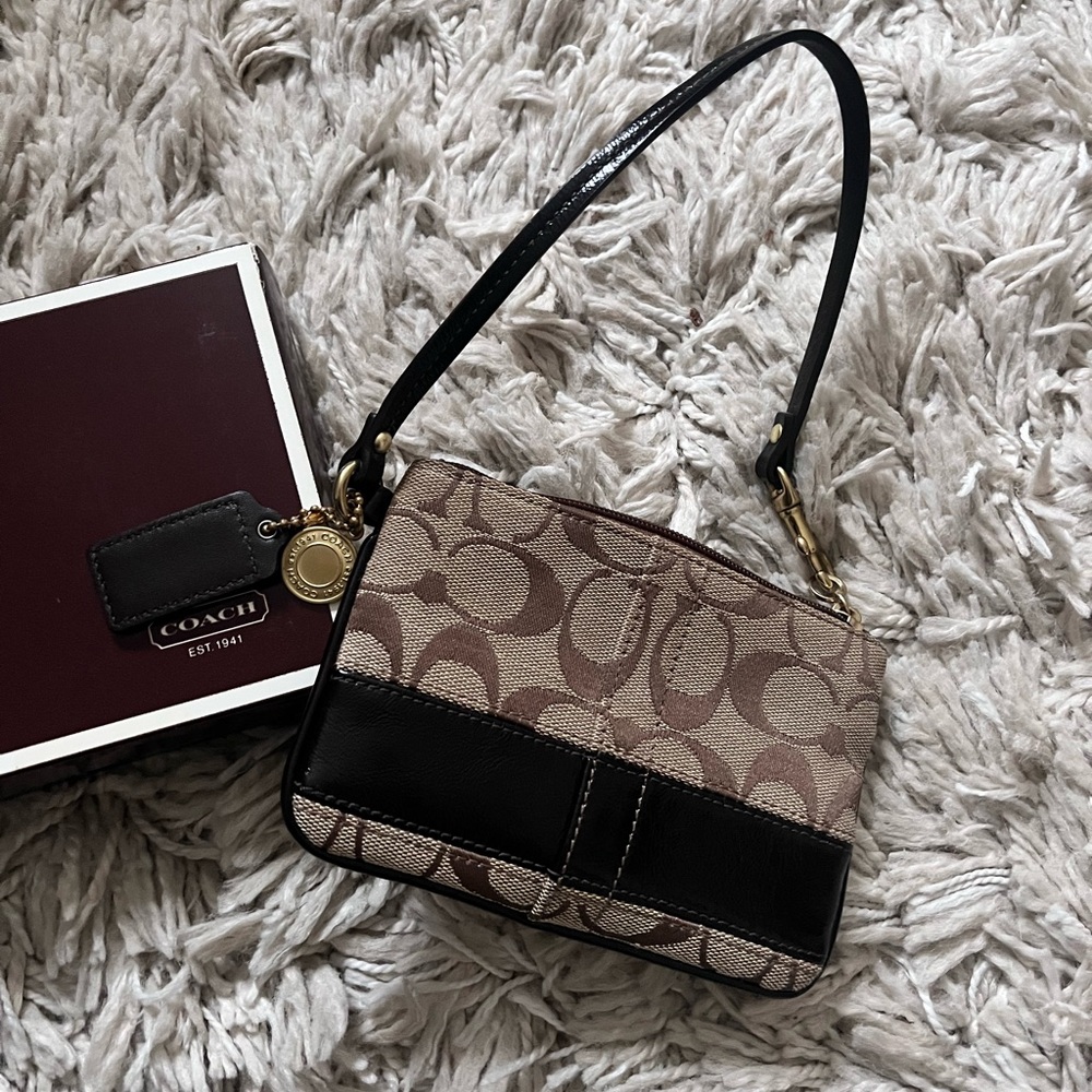 Vintage Coach Brown/ Tan signature Wristlet w/ original box. Perfect Condition.